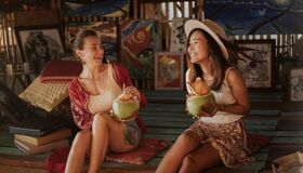 Tourists Enjoy Coconut Juice in Thailand